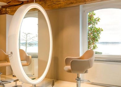 Stylish salon space at BLONDE.LAB by Caroline Rohwer — Zug, Zug, CH with scenic window view and modern design.