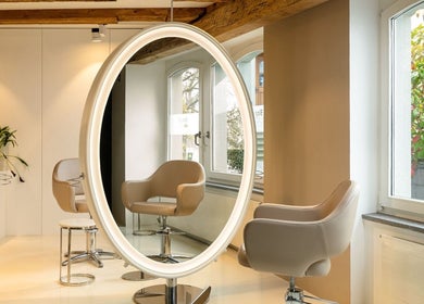 Modern salon interior at BLONDE.LAB by Caroline Rohwer — Zug, featuring stylish seating and mirrors in Zug, Zug, CH.