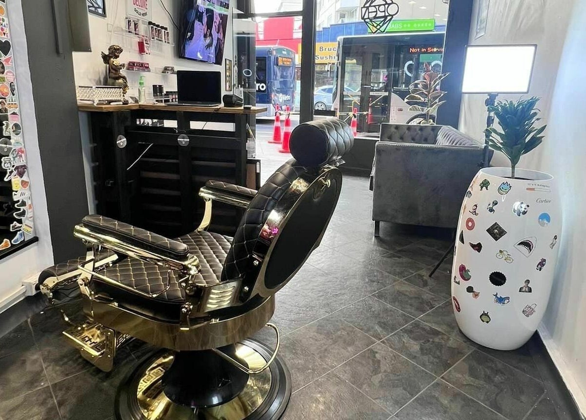 Elegant barber chair at Studio Image Barbershop in Auckland, Auckland, NZ, showcasing stylish interior.
