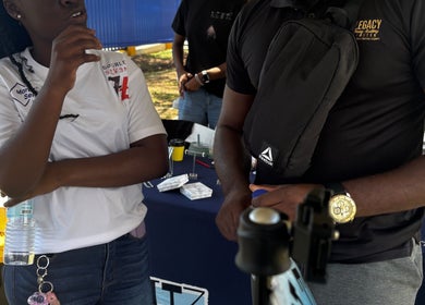 Attendees discussing at Legacy Driving Academy | Yallahs, Yallahs, St. Thomas Parish, JM event.