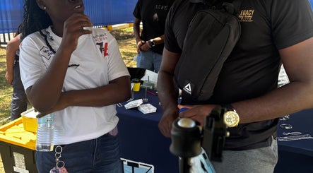 Attendees discussing at Legacy Driving Academy | Yallahs, Yallahs, St. Thomas Parish, JM event.