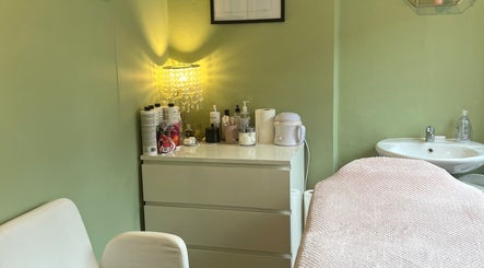 Cozy treatment room at 1 Love Enhancink @Studio55, Urmston, England, GB, featuring a serene setup and soft lighting.