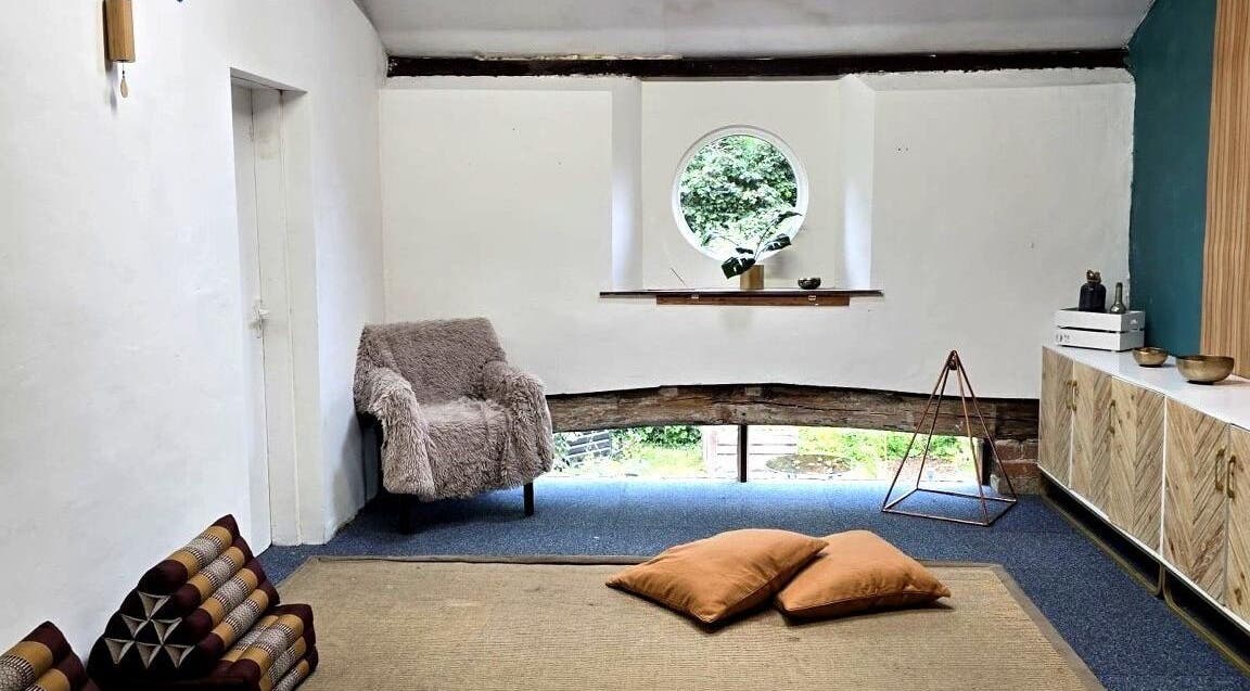Inviting relaxation space in The Unity Room, Carrington, England, GB with cushions and natural light.
