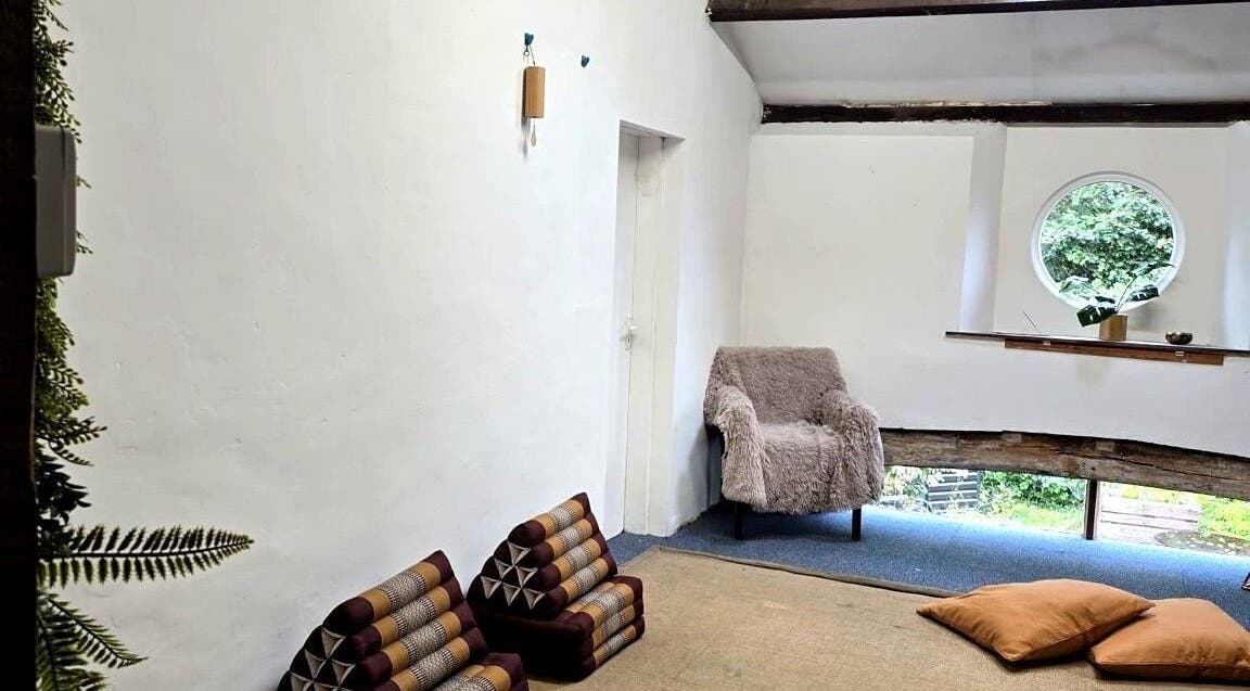 The Unity Room's tranquil reading nook with plush seating in Carrington, England, GB, offering a serene escape.