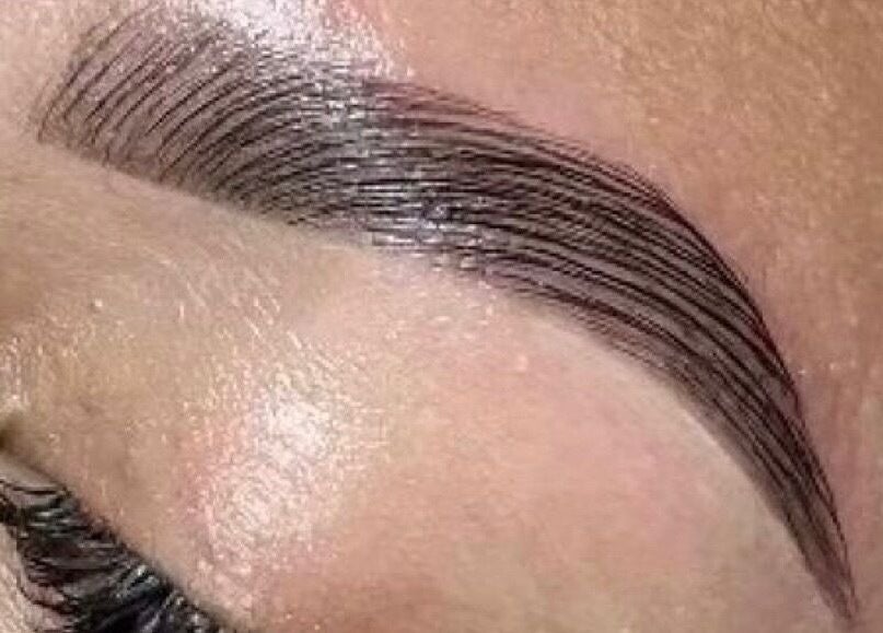 Perfectly shaped eyebrow at The Beauty Collective, O'fallon, Missouri, US, showcasing expert microblading.