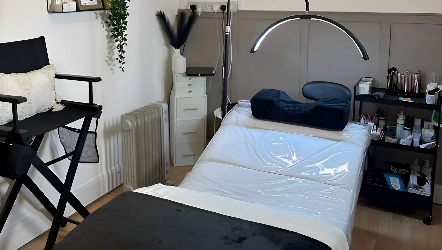 Relaxing beauty treatment room at Charlchapman Beauty Studios, Redditch, England, GB, featuring a therapy bed and decor.