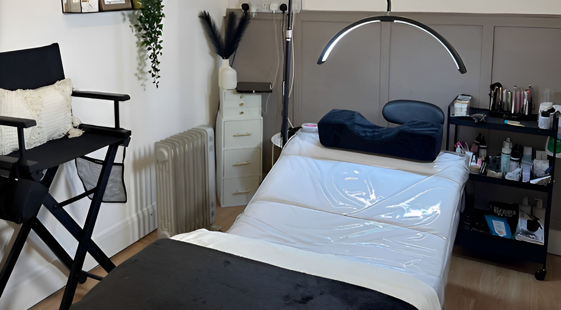 Relaxing beauty treatment room at Charlchapman Beauty Studios, Redditch, England, GB, featuring a therapy bed and decor.