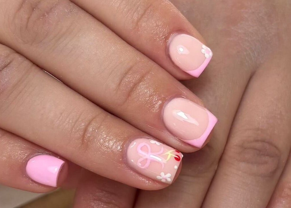 Pink floral nail art at Charlchapman Beauty Studios in Redditch, England, GB, showcasing delicate designs.
