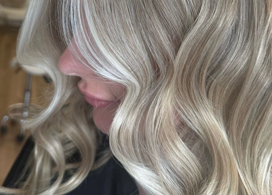 Elegant blonde curls styled at Charlchapman Beauty Studios, Redditch, England, GB, showcasing luxurious hair treatments.