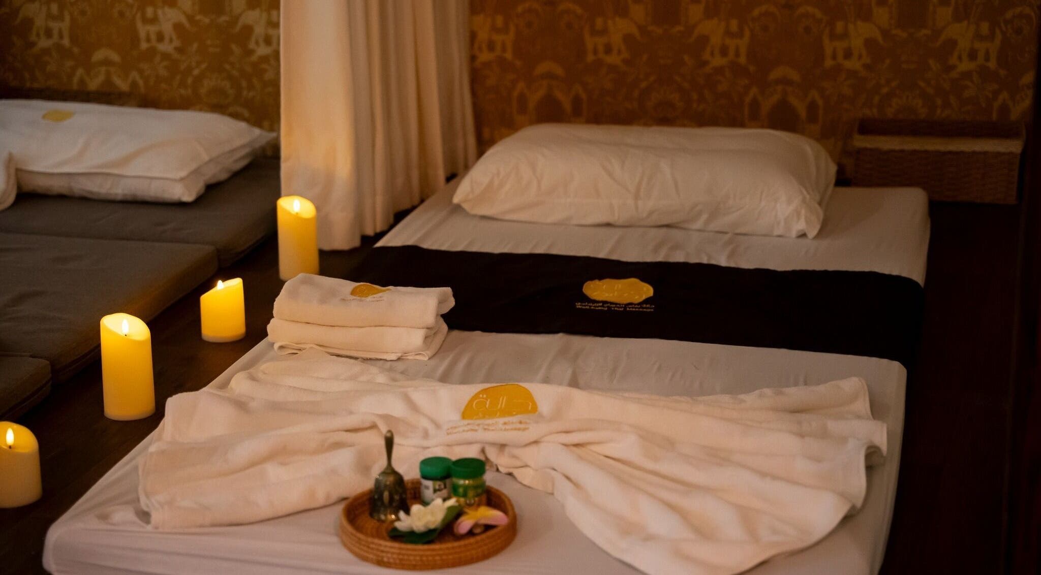 Relaxing massage setup with candles at Wellbeing Thai Massage- Dragon Palace Complex, Jeddah, Makkah Province, SA.