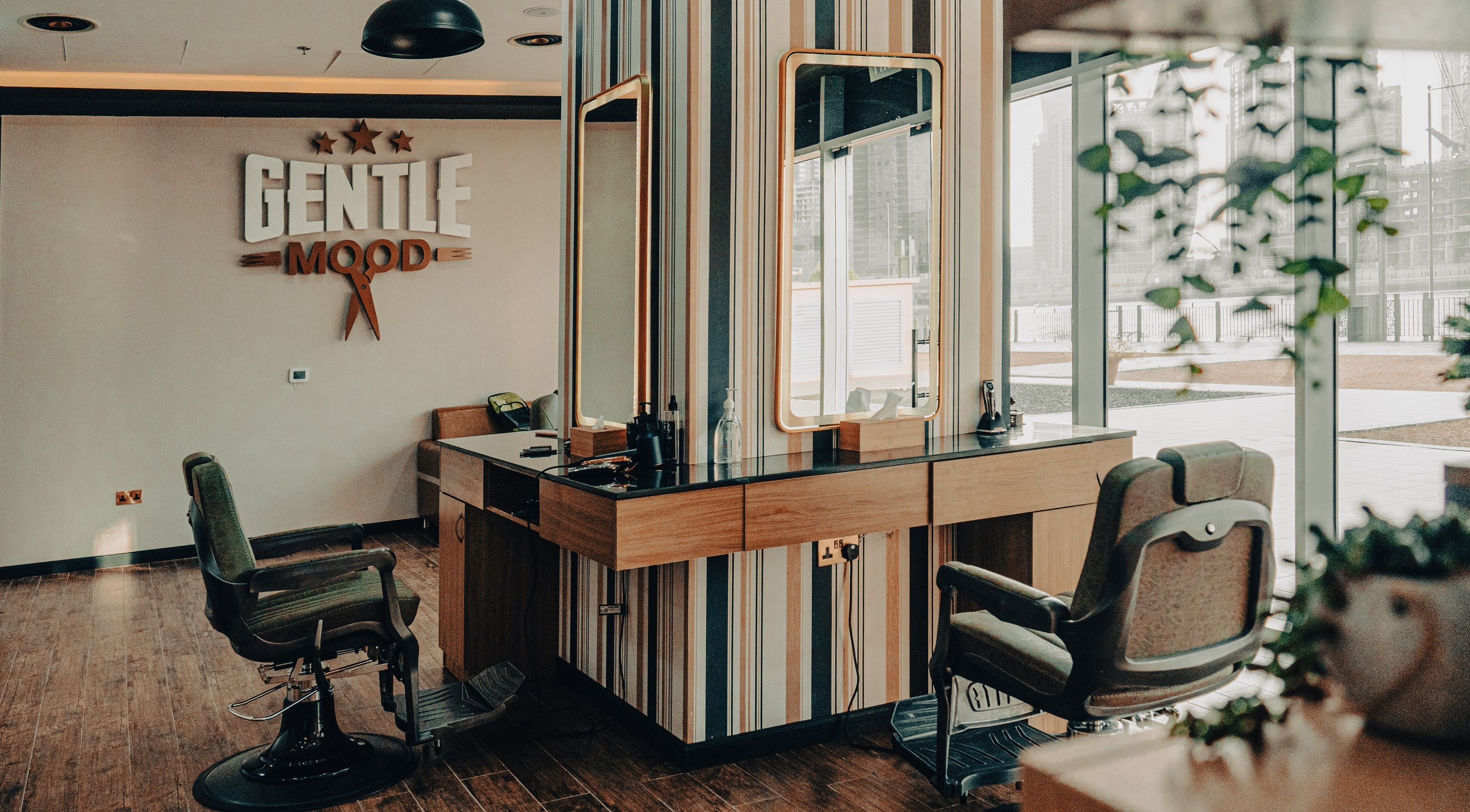 Interior of Gentle Mood Gents Salon in Dubai, AE showing stylish barber chairs and mirrors.