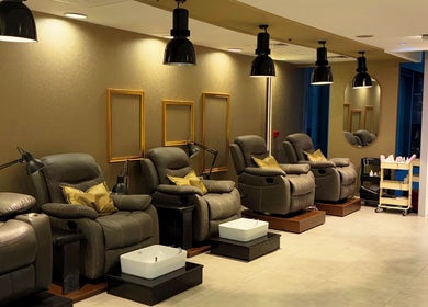 Comfortable pedicure chairs at M and N Nail Spa in Dubai, AE, offering a relaxing nail experience.