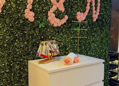 Chic nail polish display at M and N Nail Spa, Dubai, AE with floral decor.
