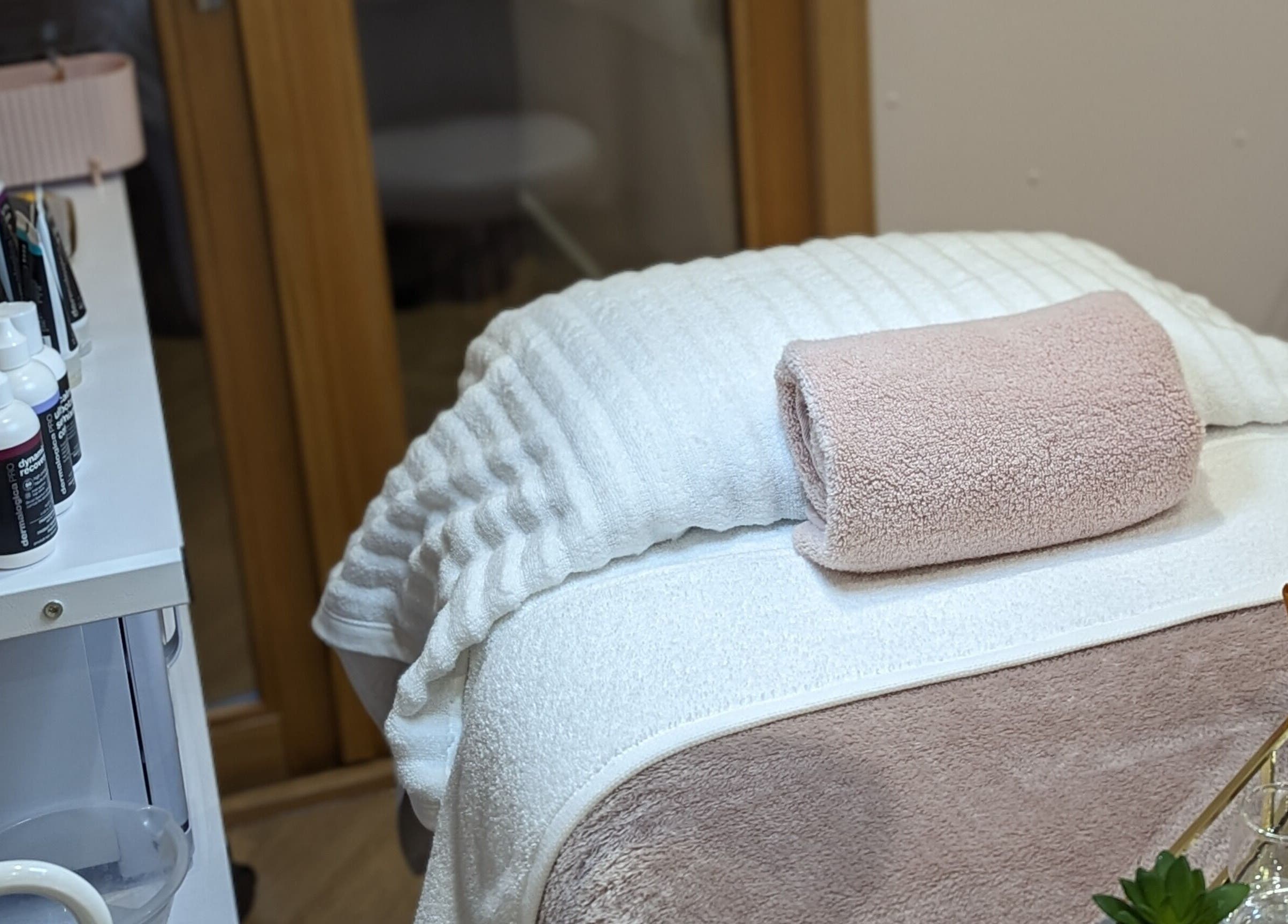 Cozy treatment area at GBM Beauty Aesthetics, Ruislip, England, GB, showcasing elegant setup and professional products.