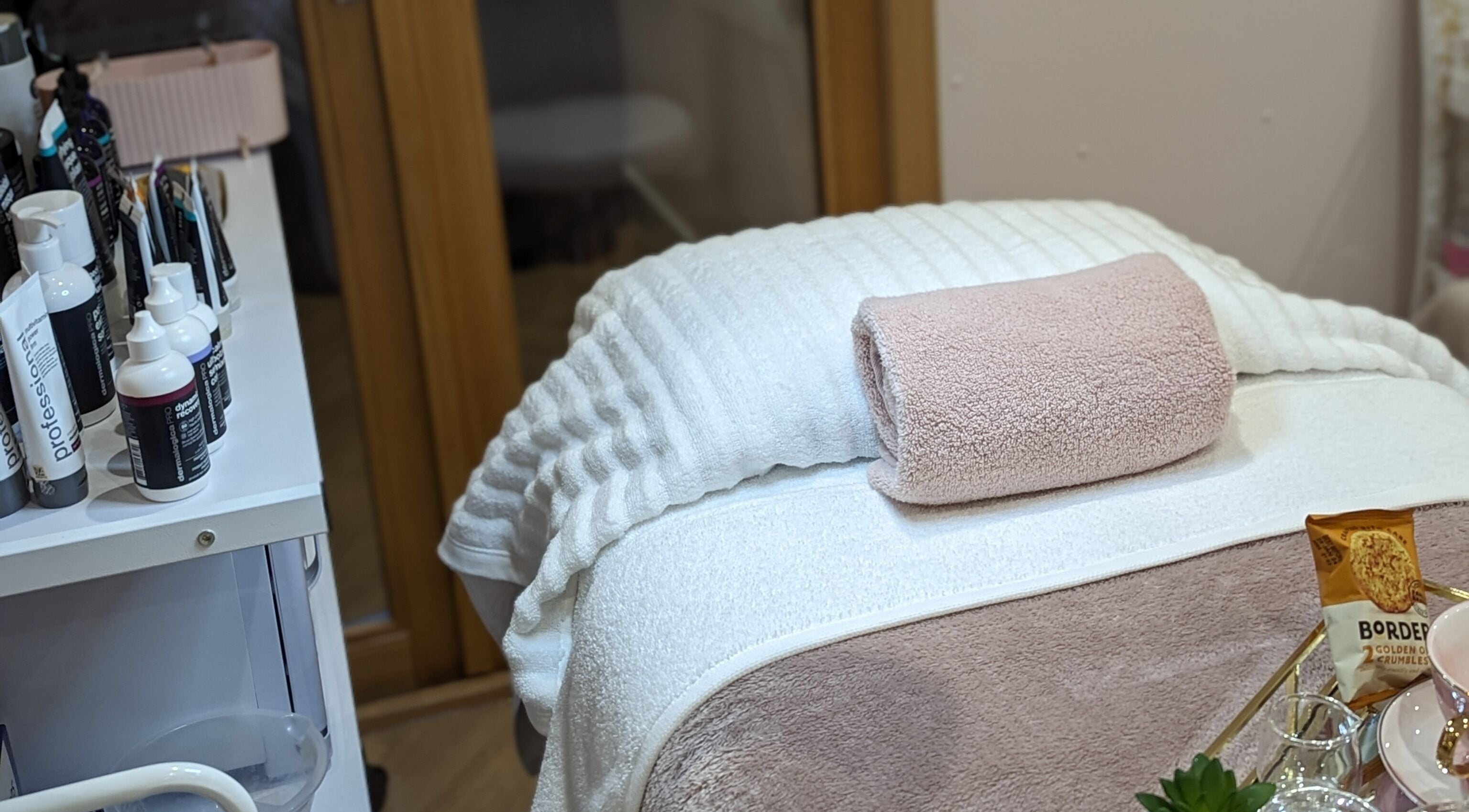 Cozy treatment area at GBM Beauty Aesthetics, Ruislip, England, GB, showcasing elegant setup and professional products.