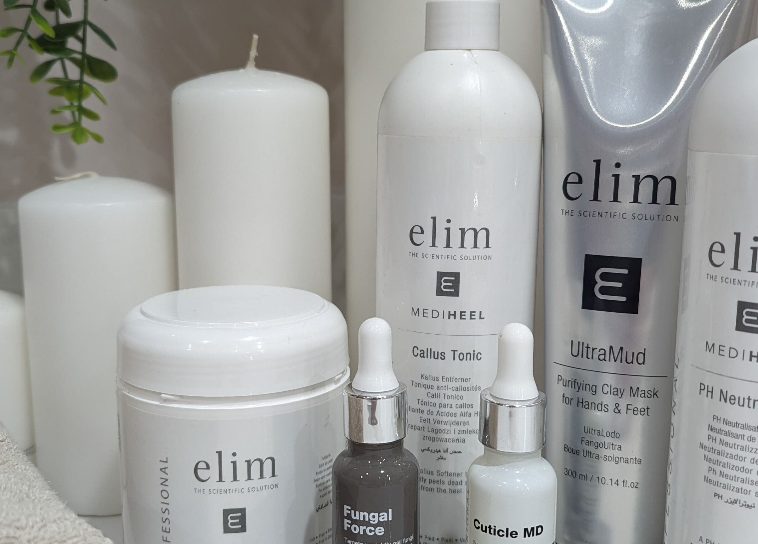 Skincare products on display at GBM Beauty Aesthetics, Ruislip, England, GB with candles and plants.