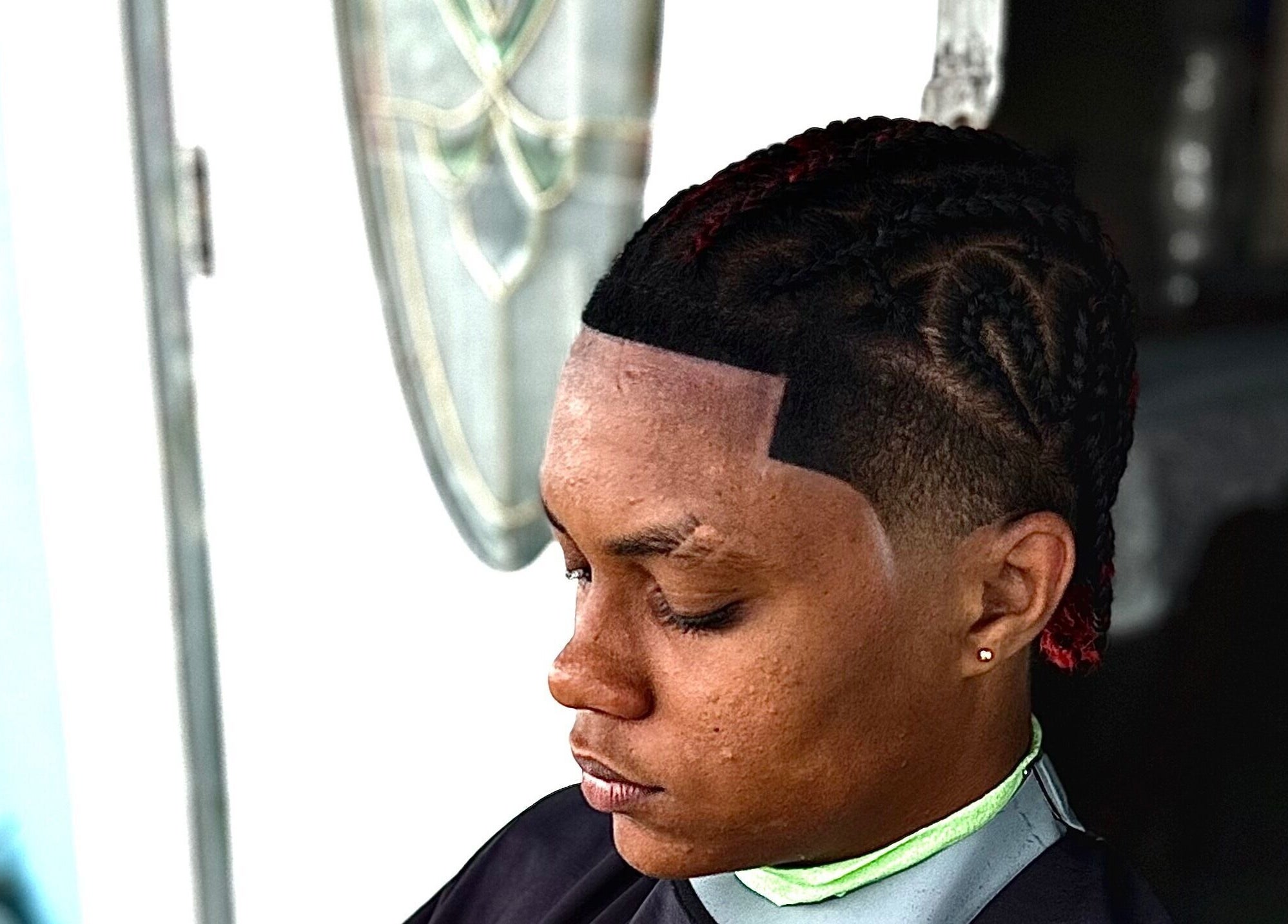 Close-up of a stylish braid at CliffCutz, St.patricks, Christ Church, BB, showcasing expert hairstyling.