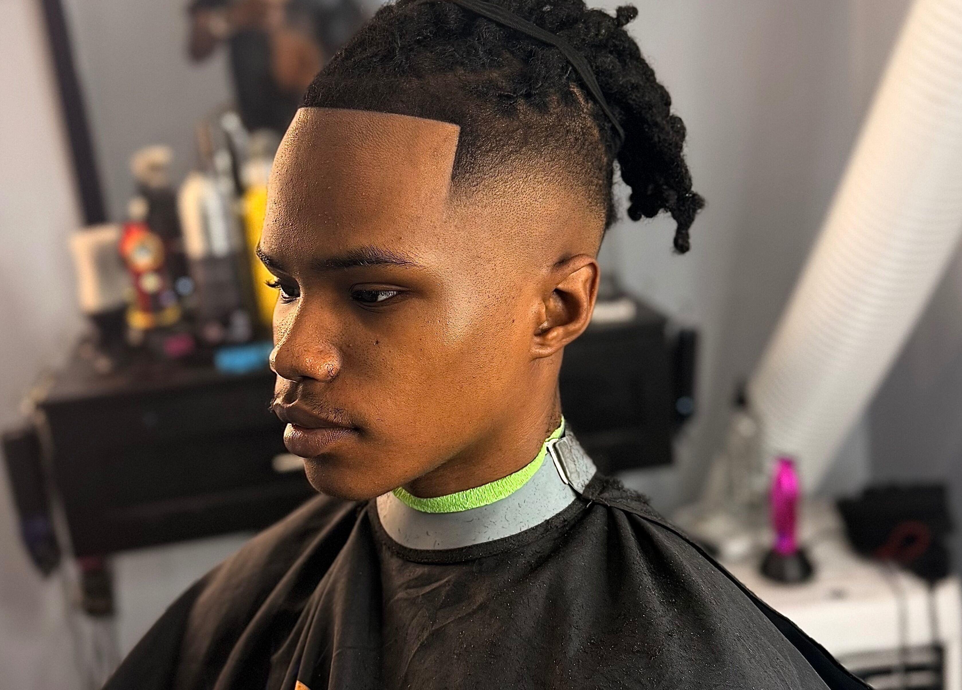 Man showcasing a fresh fade hairstyle at CliffCutz, St.patricks, Christ Church, BB.