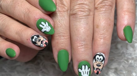 Cartoon-themed green nails at Dezz Nails and Glam Studio, Johannesburg, Gauteng, ZA showcasing unique design.