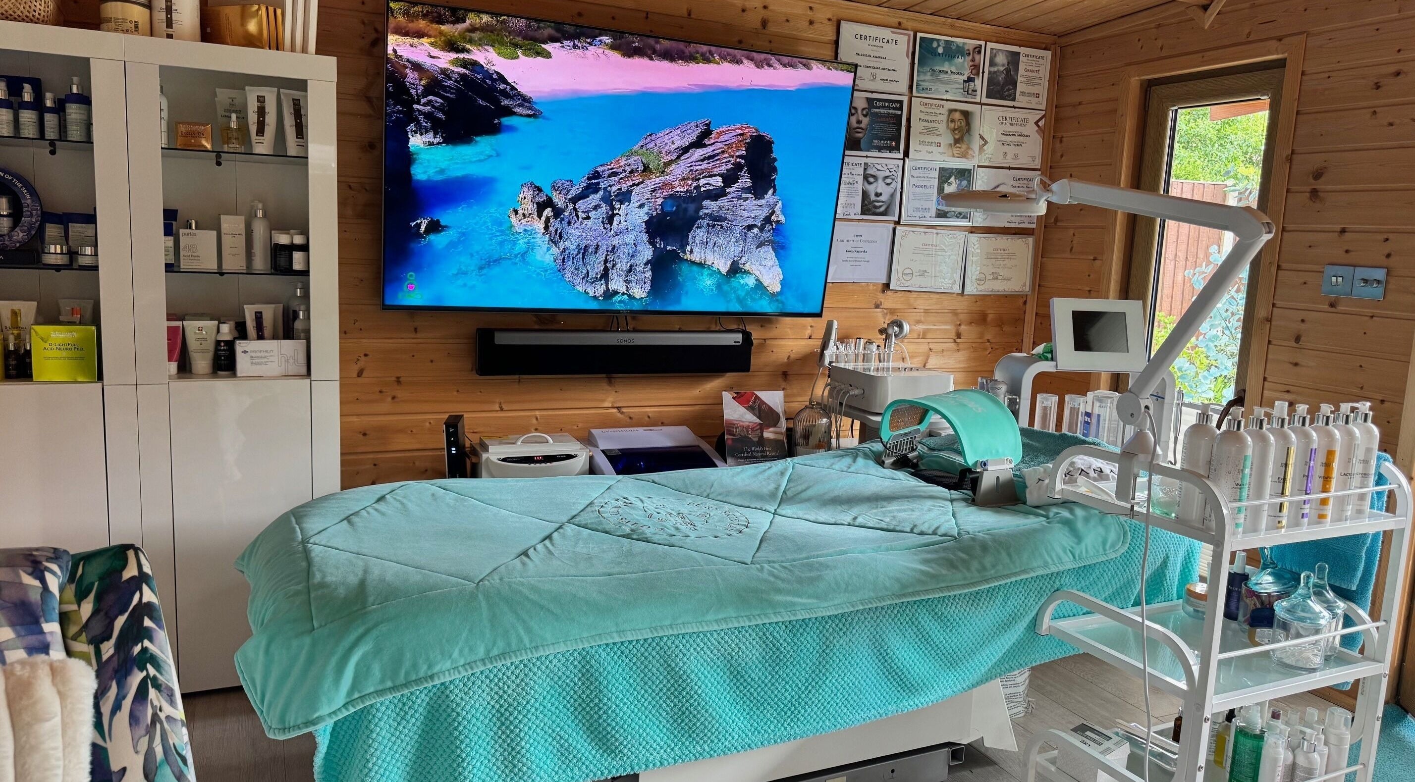 PureSkinBar in Farnborough, England, GB offers a serene spa room with a cozy treatment bed and calming decor.