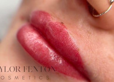 Close-up of vibrant lips at Taylor Fenton Cosmetics, Whitstable, England, GB, showcasing lip treatment.