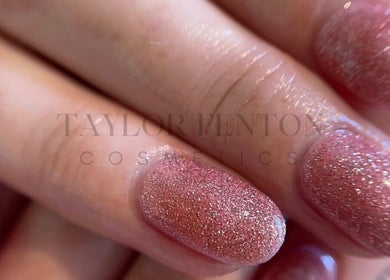 Close-up of glittery pink nails at Taylor Fenton Cosmetics, Whitstable, England, GB.