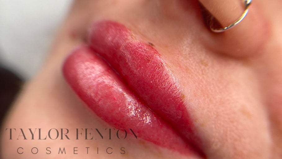 Glossy red lips at Taylor Fenton Cosmetics, Whitstable, England, GB highlighting vibrant lip care.