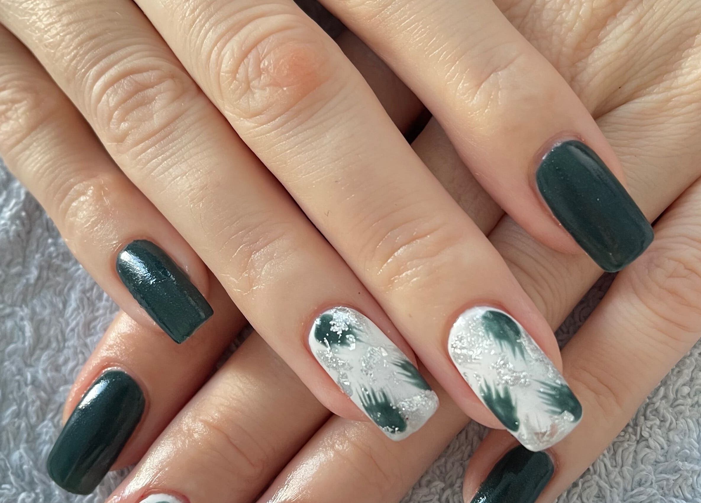Chic green and white nail art at Taylor Fenton Cosmetics, Whitstable, England, GB.