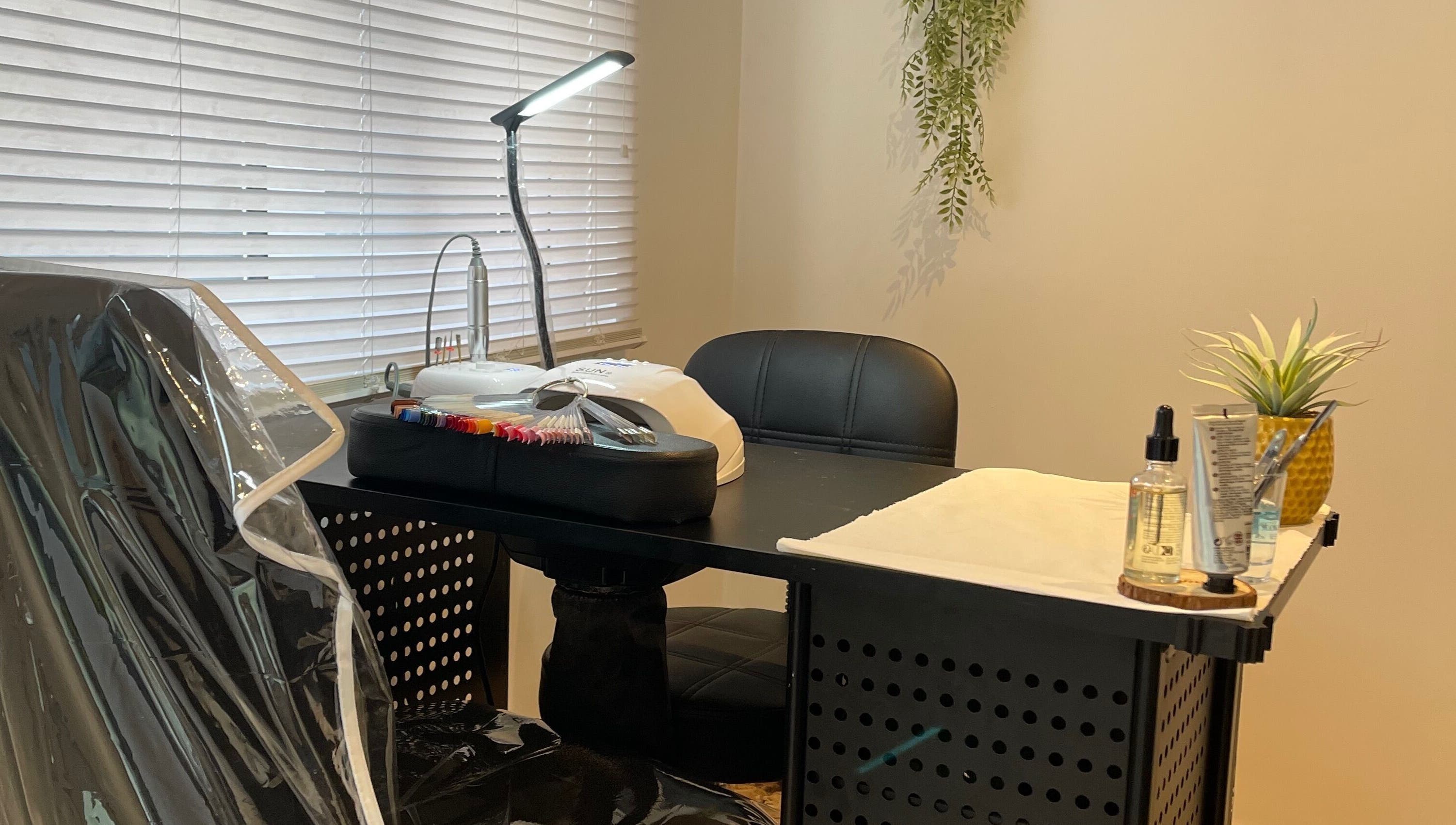 Nail station at Taylor Fenton Cosmetics in Whitstable, England, GB with tools and greenery for relaxation.