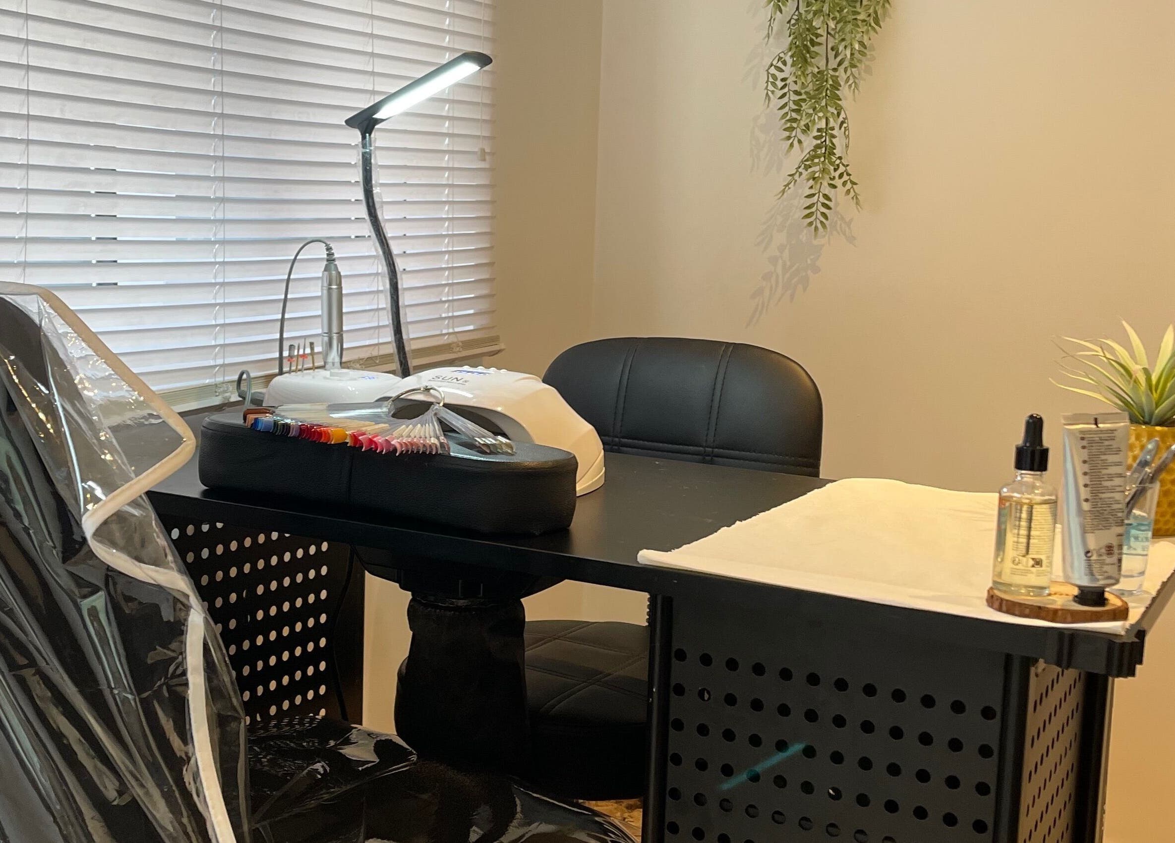 Nail station at Taylor Fenton Cosmetics in Whitstable, England, GB with tools and greenery for relaxation.