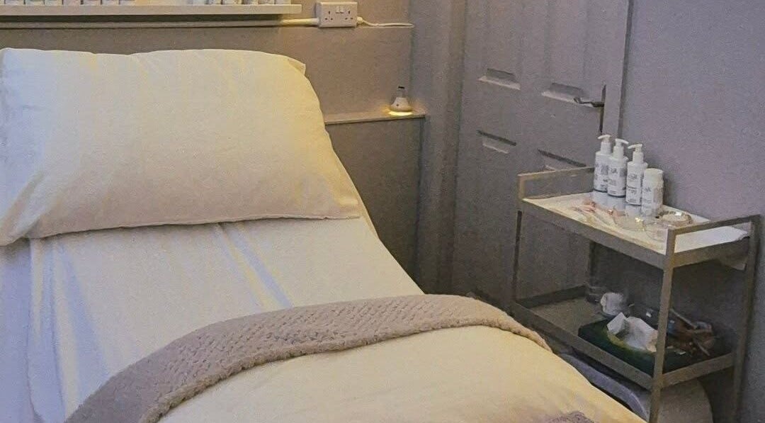 Cozy treatment bed at Nirvana Beauty & Massage, Bonnybridge, Scotland, GB, highlighting soothing comfort.