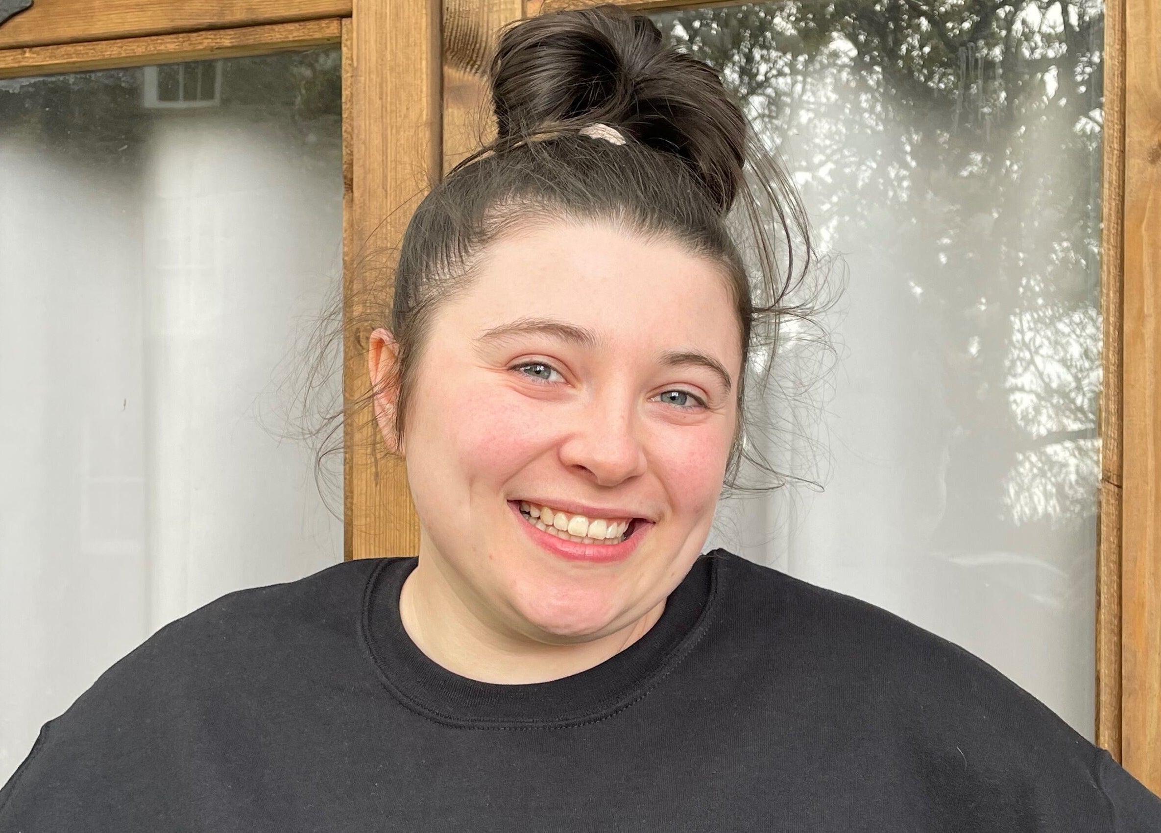 Friendly staff member at Martindale Nails, Kendal, England, GB, warmly welcoming guests.