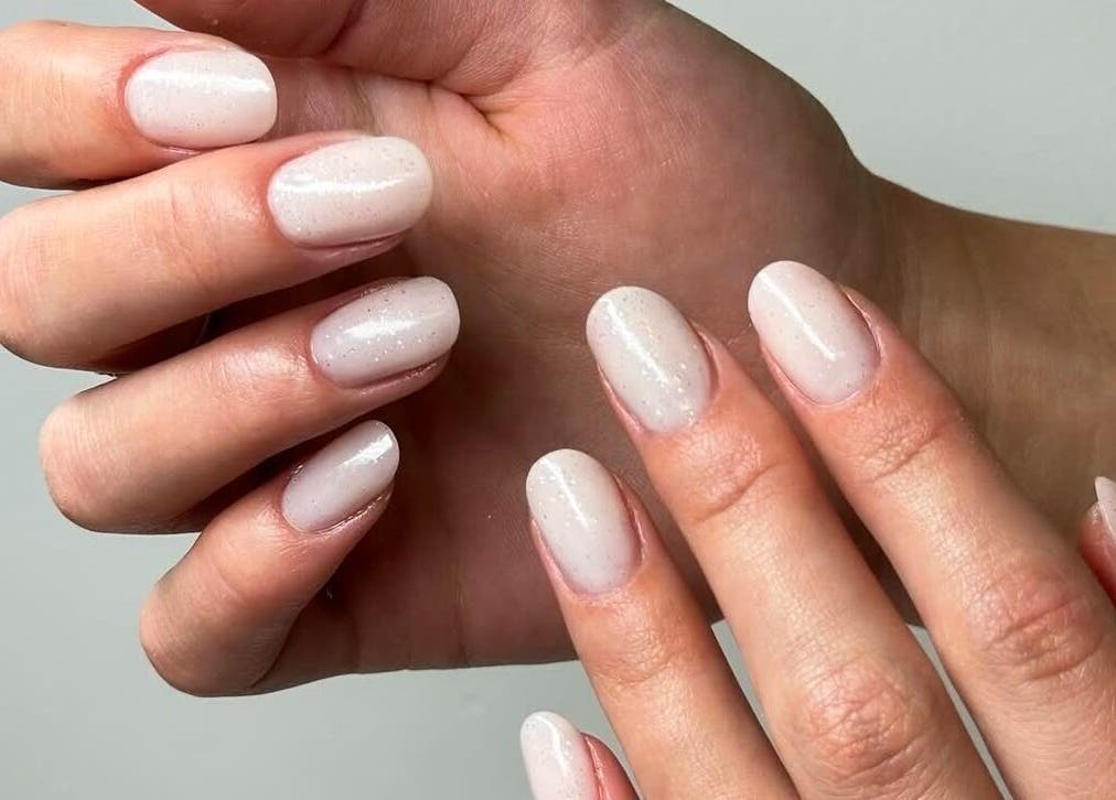 Elegant manicure at Majesty Nails and Spa in Calgary, Alberta, CA, showcasing glossy, natural nails.