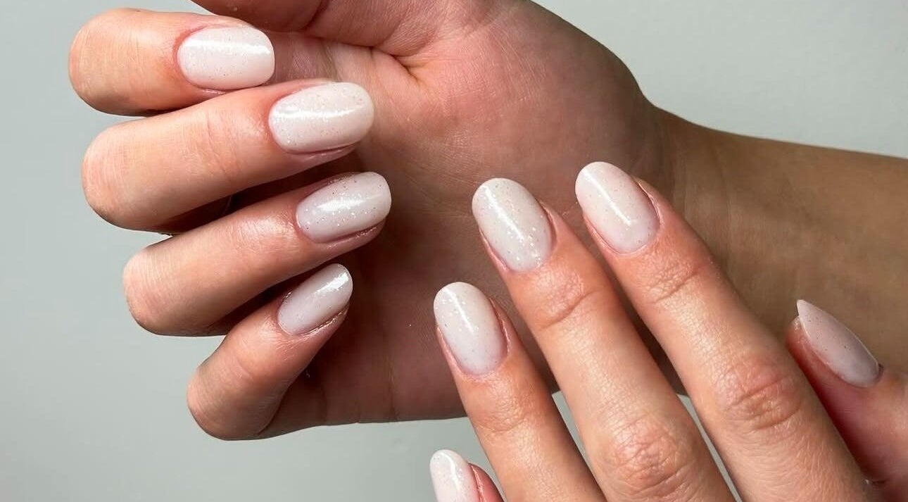 Elegant manicure at Majesty Nails and Spa in Calgary, Alberta, CA, showcasing glossy, natural nails.
