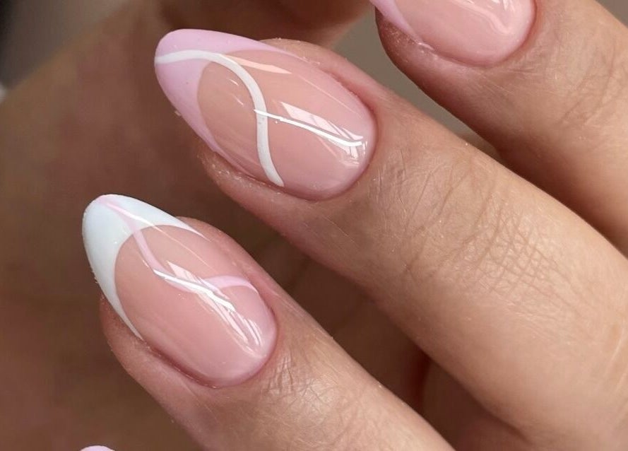 Stylish pink and white nails at Majesty Nails and Spa, Calgary, Alberta, CA. Perfect for a chic look.