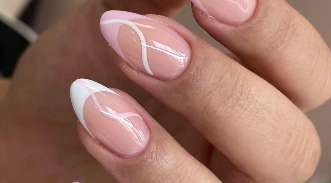 Stylish pink and white nails at Majesty Nails and Spa, Calgary, Alberta, CA. Perfect for a chic look.