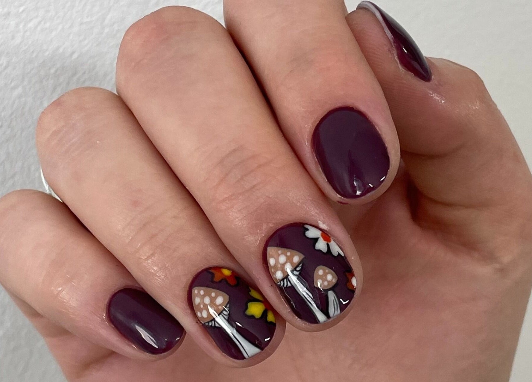 Floral nail art at Majesty Nails and Spa in Calgary, Alberta, CA offers chic, trendy designs.