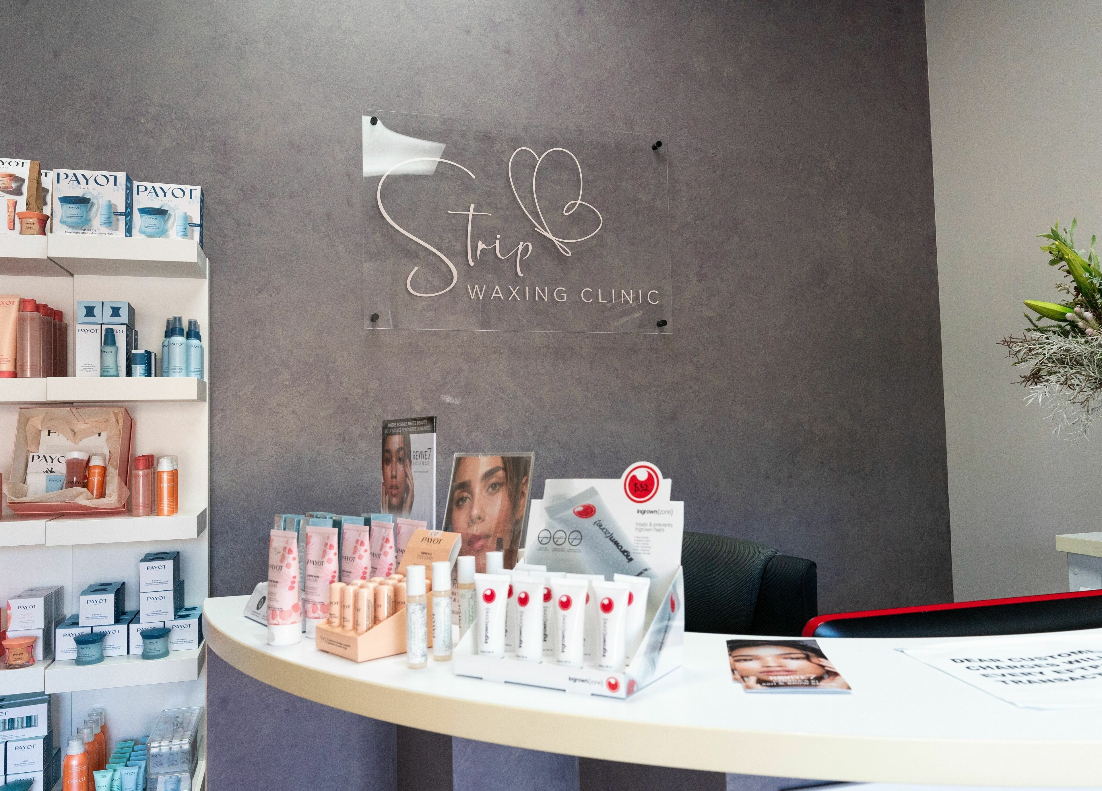 Elegant interior of Strip Womens Waxing Clinic, Subiaco, Western Australia with products and floral decor.