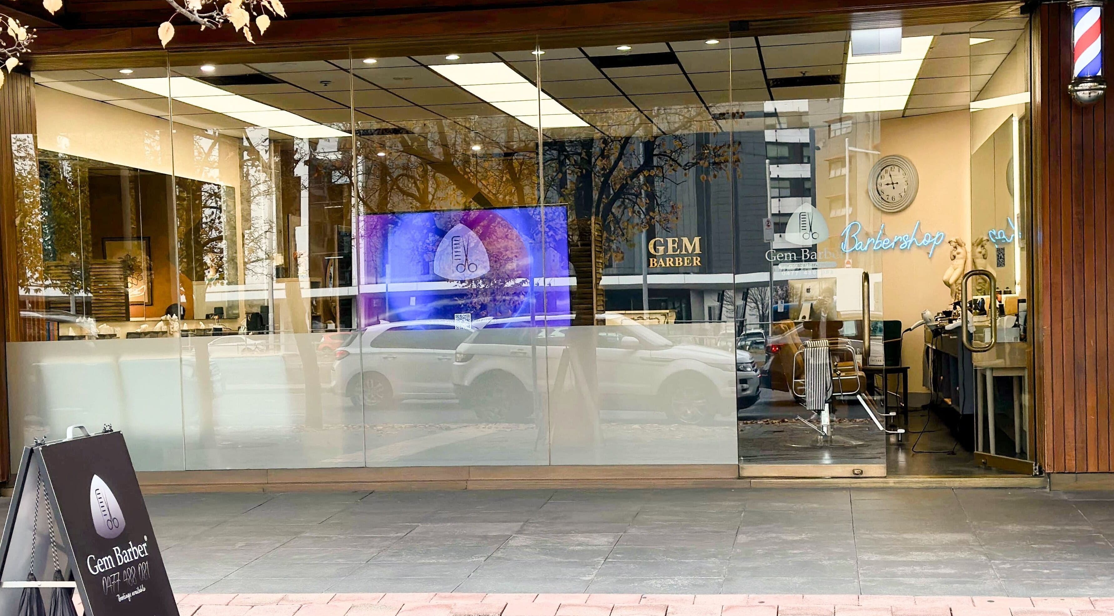 Gem Barber's sleek storefront in Canberra, Australian Capital Territory, AU with inviting glass facade.