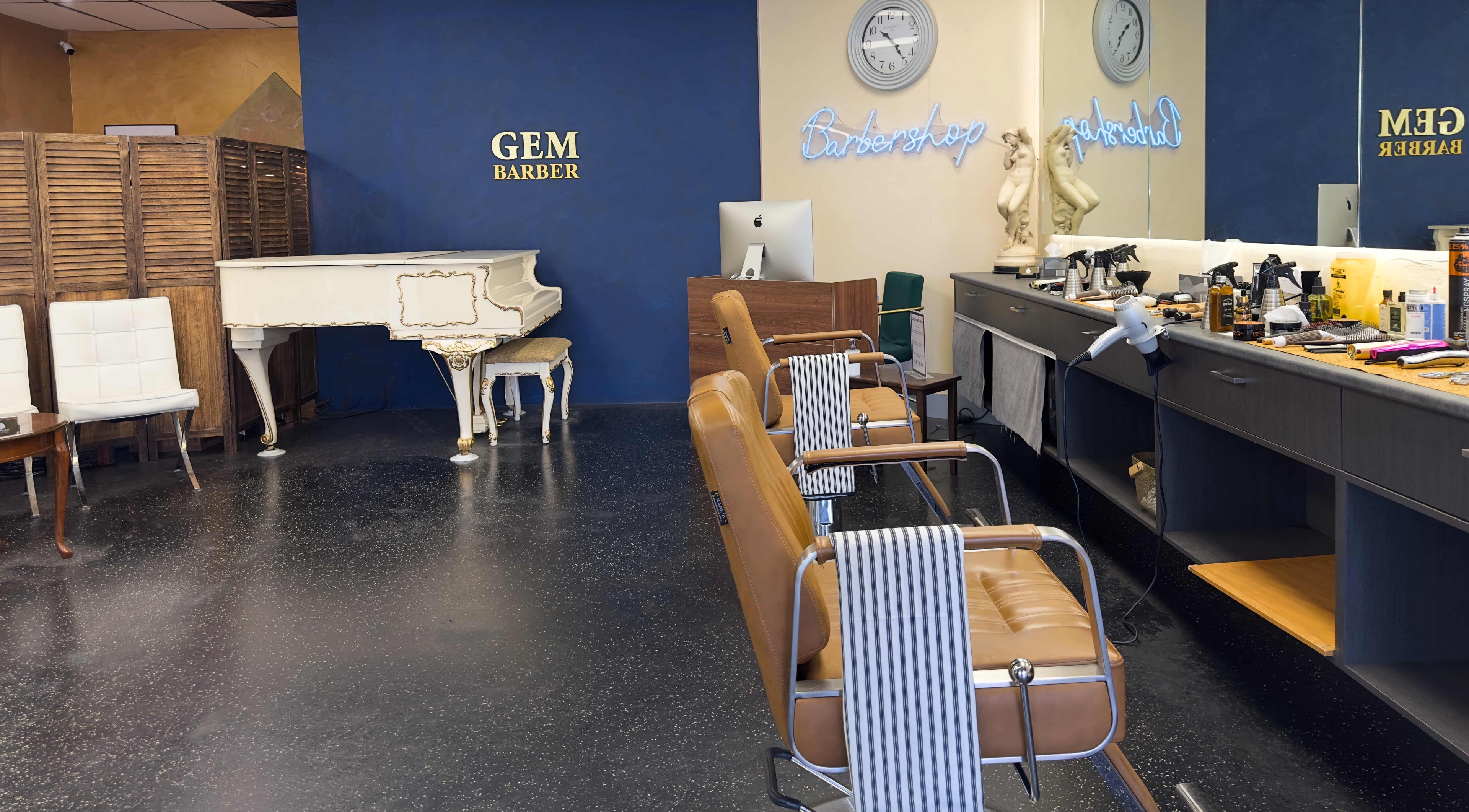 Gem Barber, a stylish barbershop in Canberra, Australian Capital Territory, AU, featuring elegant decor and seating.