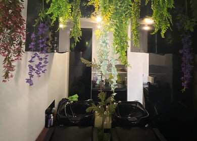 Hanging greenery at Topcurls Salon, a serene beauty space in Singapore, Singapore, SG with elegant decor.