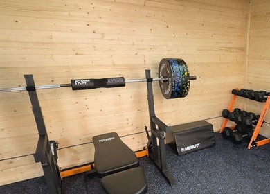 Modern gym setup at The Strength Studio & Sports Massage in Eastleigh, England, GB with weights and bench.