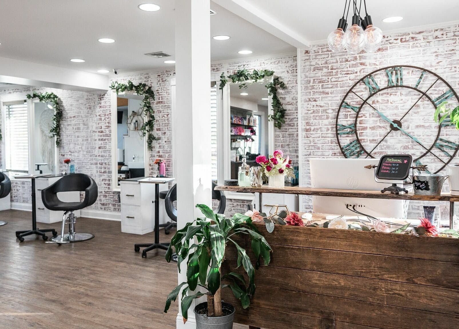 Stylish interior of Alchemy, the Salon, Fairfield, Connecticut, US with modern decor and elegant seating.