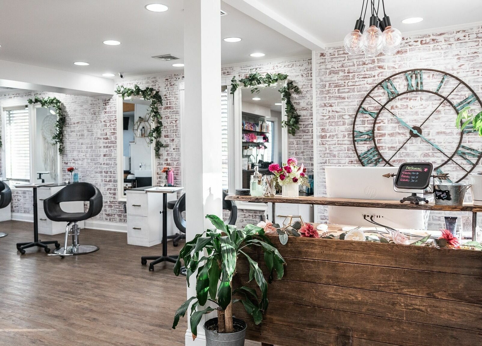 Stylish interior of Alchemy, the Salon, Fairfield, Connecticut, US with modern decor and elegant seating.
