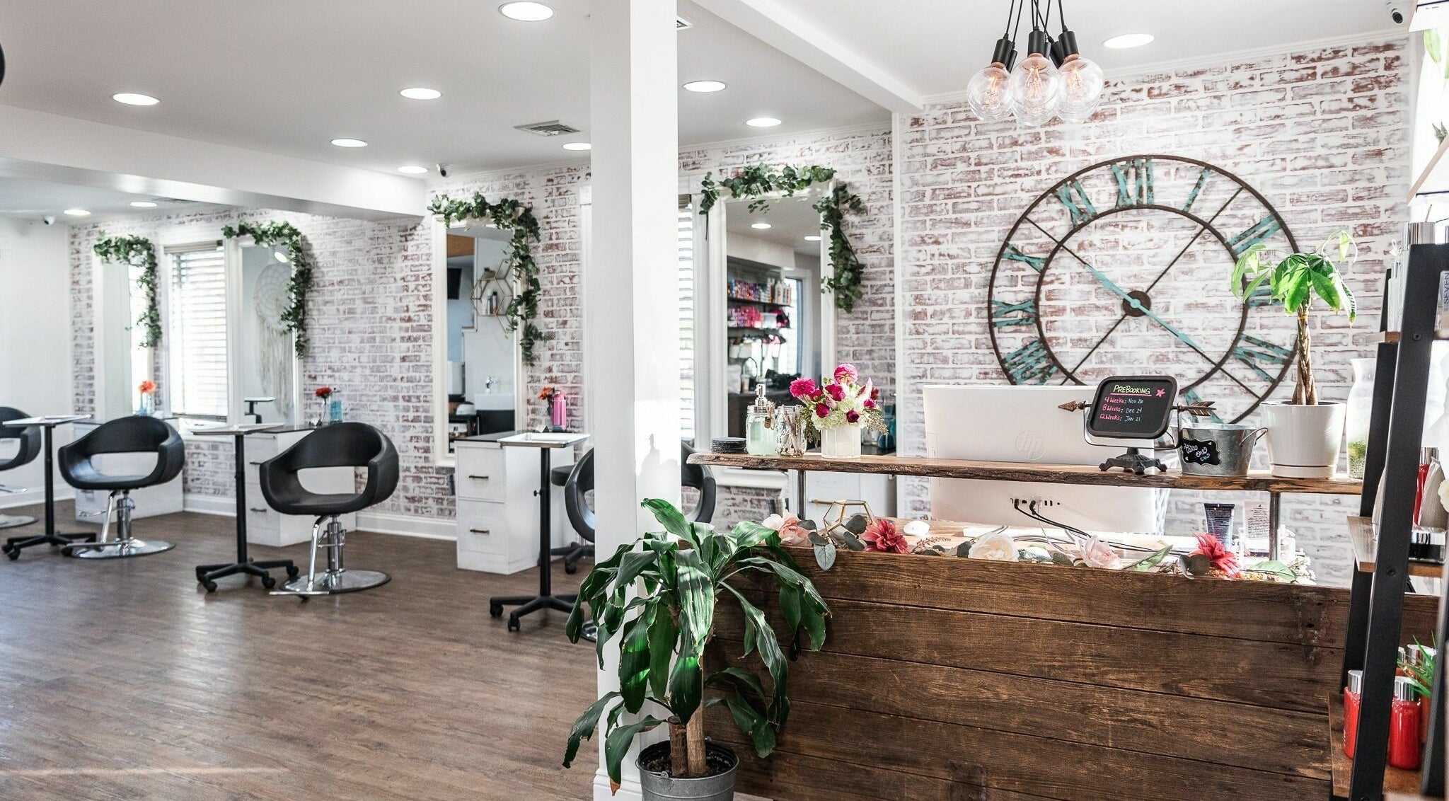 Stylish interior of Alchemy, the Salon, Fairfield, Connecticut, US with modern decor and elegant seating.