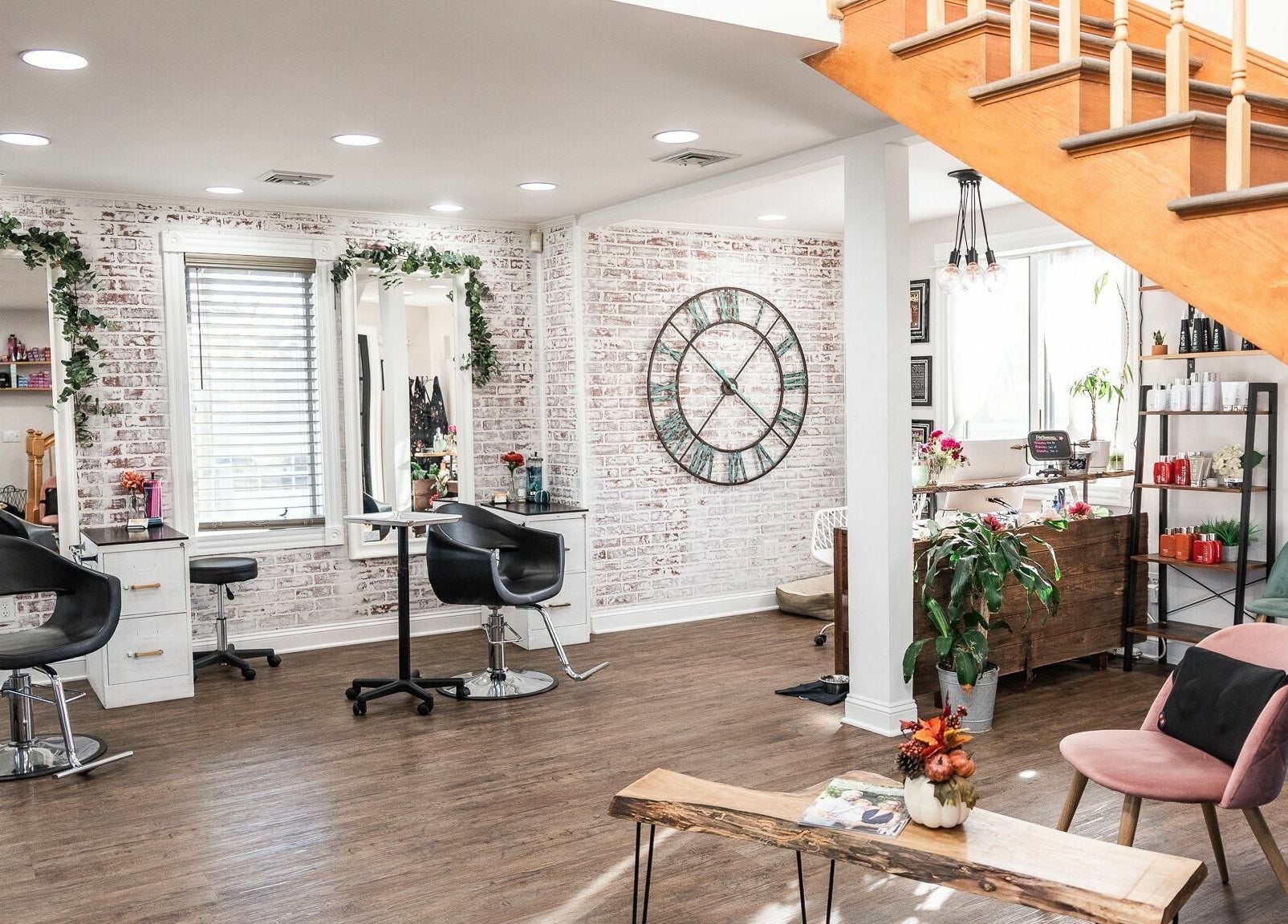Modern interior of Alchemy, the Salon in Fairfield, Connecticut, US with stylish decor and seating.