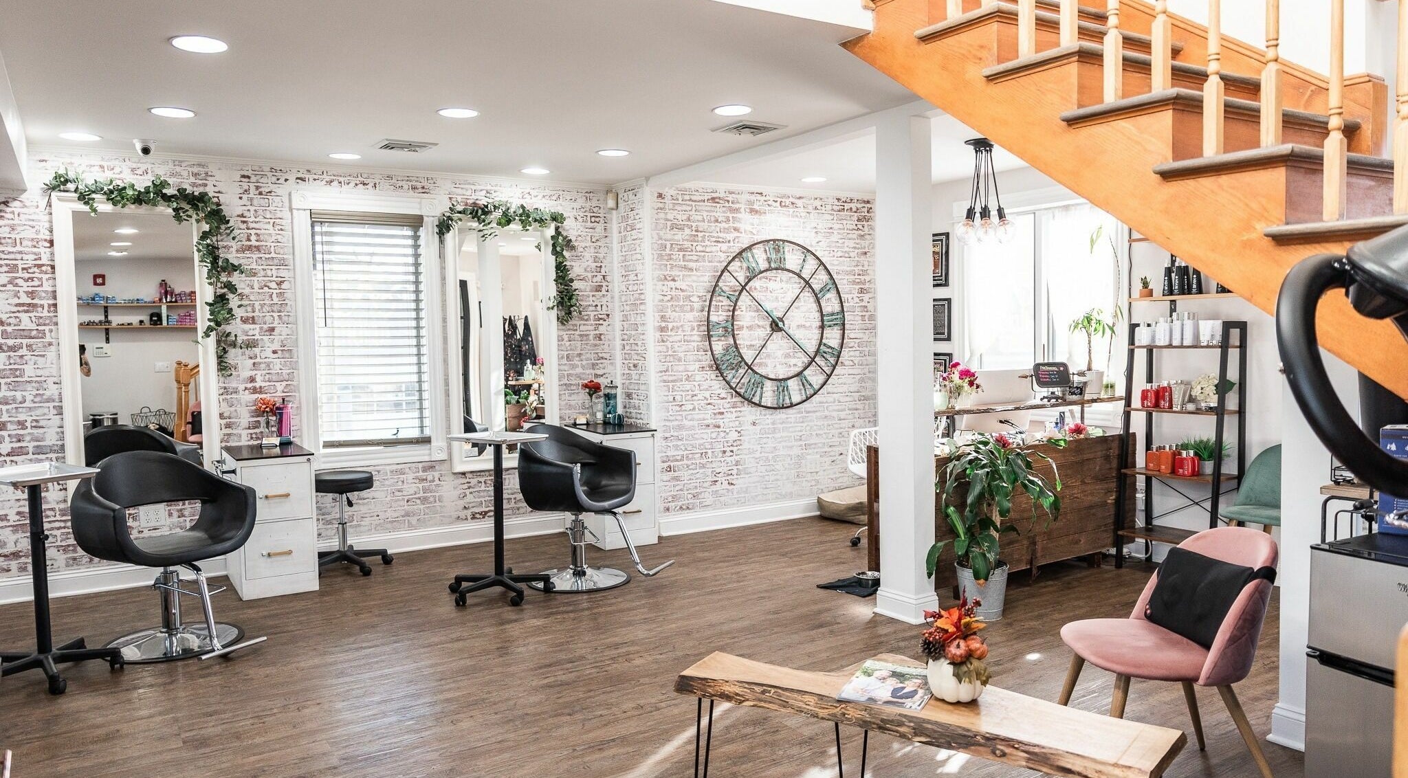 Modern interior of Alchemy, the Salon in Fairfield, Connecticut, US with stylish decor and seating.