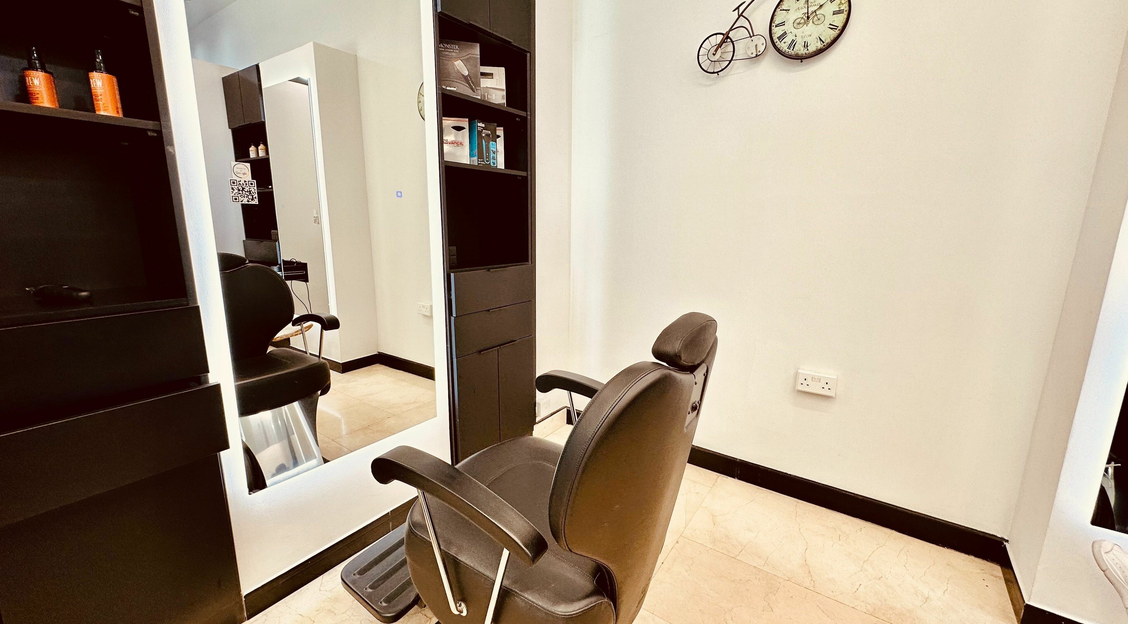 Chic salon chair at Cutting Crew - Holiday Inn Al-Barsha, Dubai, AE offering luxurious beauty services.