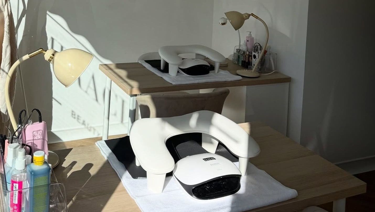 Nail station setup at Miracles Beauty Salon, Brighouse, England, GB, with lamps and manicure tools.