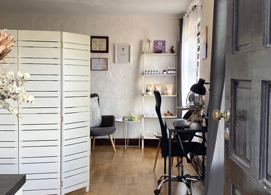 Christie's Wellness Room - Medical Massage Therapy in Cape Town. Inviting interior with decor and massage certificates.